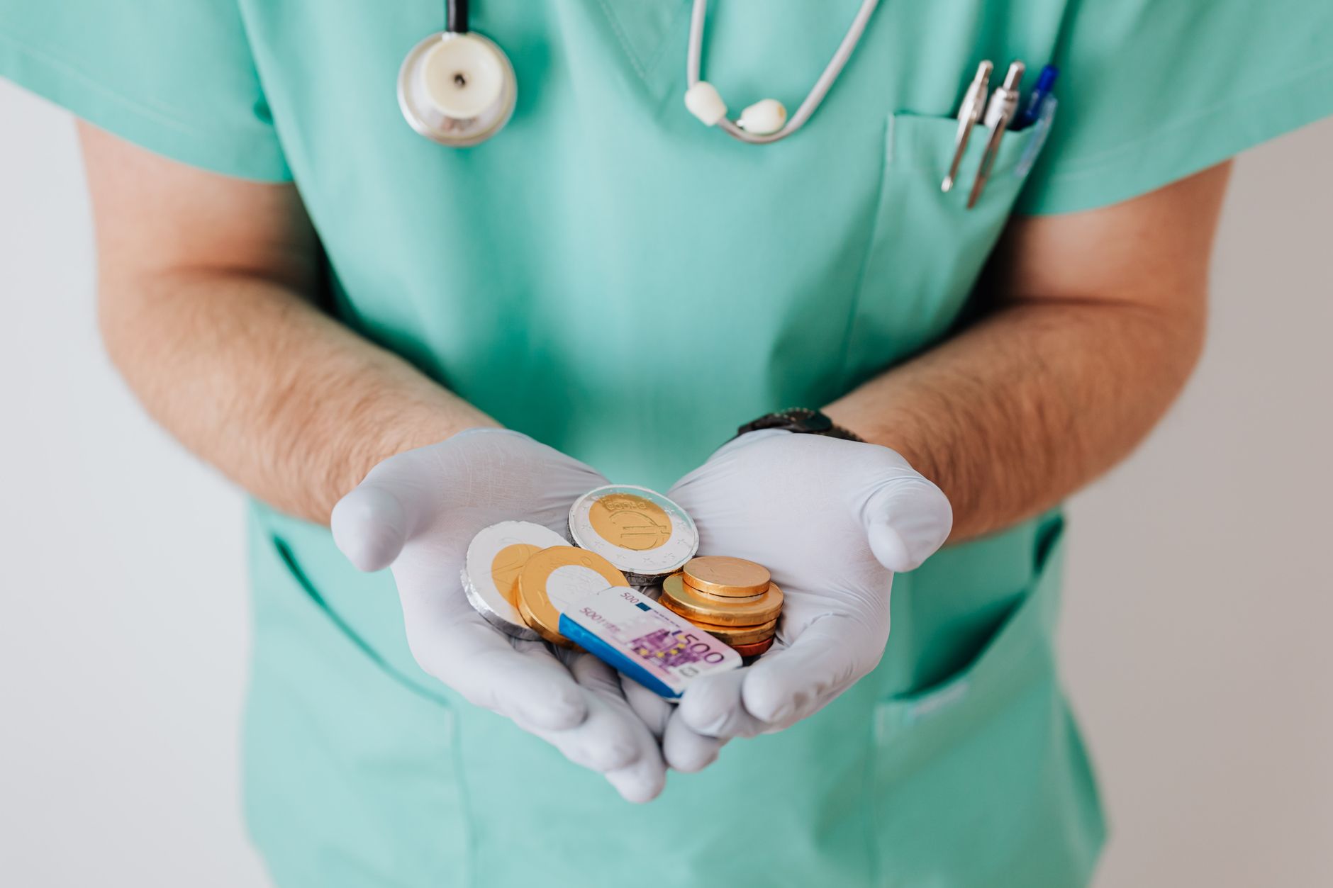 doctor showing cash money in clinic